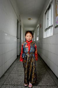 School girl in hall of elementary school in Lhasa, Tibet. © Forest McMullin