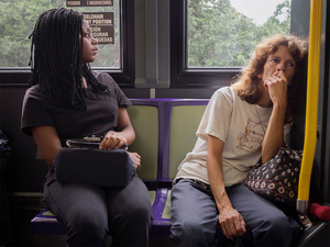 USA. New Orleans. 2015. Black girl and white woman in a bus.