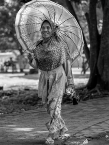 Elegant tourist visiting Prambanan, a complex of Hinduist Temples in Yogyakarta region.