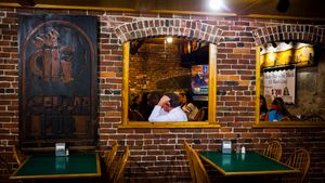 Republican presidential candidate Gov. John Kasich of Ohio stops for lunch at Biederman's Deli in Plymouth during a campaign bus tour through New Hampshire on Wednesday, Oct. 14, 2015.