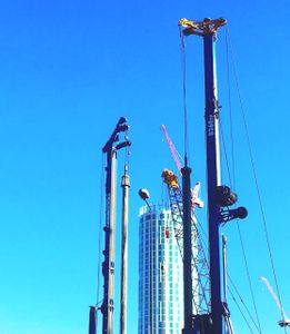 Turqouise Tower And Cranes