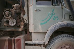 Trucks carrying building materials and water
