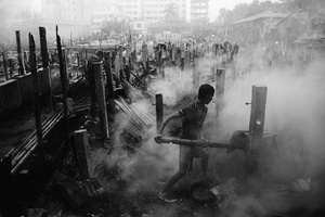 A man from this boarding house trying to save his belongings from fire
