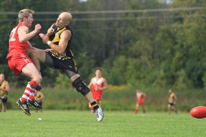 Nick DiRago lets an Ottawa Swans player know who's boss in a recent preliminary finals game.