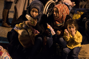 Refugees who arrived at Piraeus after registering at the Greek islands wait at the port's terminal to be transported to the new hot spot of Schisto as they are stranded in Greece shortly after the border controls at Macedonia. February 16, 2016, Pireaus, Greece.
