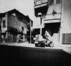 "straight" pinhole shot of the same bike downtown