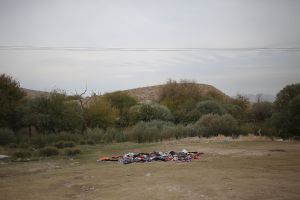 Unusable clothes which were thrown out by the victims of earthquake . The reason for this action is that the local people often wear regional clothing which is specific to their culture and they avoid wearing fashionable clothes