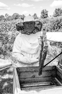 A portrait of a beekeeper