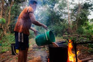 Ubaldo uses almost 100 liters of water from the river, which he's collecting by hand.