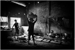 A child labor working in the furnace section.