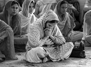 Sikh women praying in a gurdwara, Nottingham