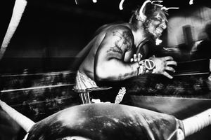 Buffa Aayooo winces in pain and grabs his chest.