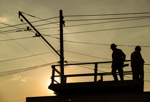 Workers at sunset