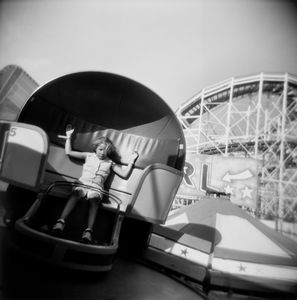 Girl on Tilt-a-Whirl, Coney Island, NY © Isa Leshko