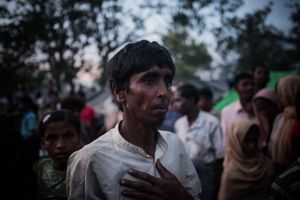 The Rohingya Refugee Crisis. A torn up Rohingya refugee, just arrived on foot from Burma, is waiting in one of the huge camps for water and food supplies. Near Ukhia, Bangladesh.
