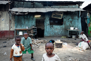 Sinai slum, Nairobi, KENYA, 29.10.2013: Children play in front of a hotel. Many children from Nairobi's townships do not attend school.