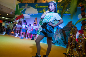 A contestant takes on the catwalk during a beauty pageant in a mall in central Yogiakarta