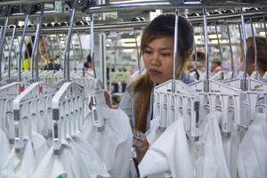 A factory worker inspects the garments. Cambodia’s garment sector employs more than 650,000 people, it was worth more than US$5bn in exports in 2013, and accounts for 80 percent of the country’s exports.