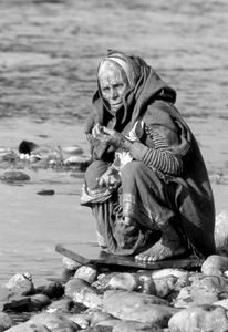 in Rishikesh, North India, praying in Ganga river