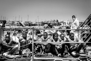 106 Somali migrants land to Malta.They were rescued by the Armed Forces of Malta.They will go trough the process that happens  to everyone who comes this way:identification by the police,request for asylum, imprisonment,access to open centers and then either a future in Malta or the attempt to move to another EU member.Behind them Captain Etienne Scicluna,who was in command of the operation.