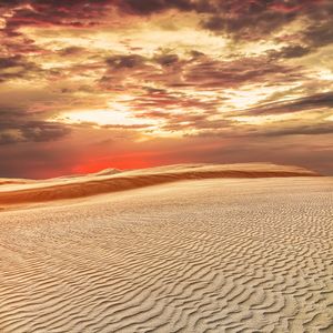 Sunset over great sand dunes in New Zealand