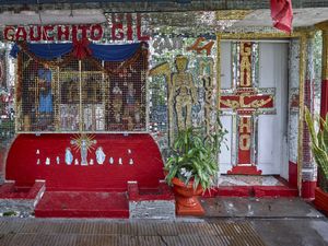 Eccentric decoration made of a mirrored tiles mosaic portraying the two popular saints Gauchito Gil and San la Muerte  of a private shrine in Resistencia in  Chaco
