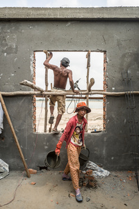 Nueon Sarueon 35 from Kandal Province works with a plasterer. She mixes cement for him. Sarueon complains about being sick and week, she says all she does is work and sleep.