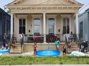 USA. New Orleans. 2015. Large family portrait outside their house in a boiling day.