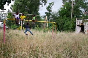 © Nicholas Gregory.     Kids play in one of Detroit's abandoned parks. The city closed more than 200 parks by 2013. Volunteer organizations have recently adopted more than 50 city parks, agreeing to maintain them in an effort to keep them open.