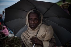 The Rohingya Refugee Crisis. An old woman, desperate and hopeless, waiting for food and water supplies, camp, near Ukhia, Bangladesh.