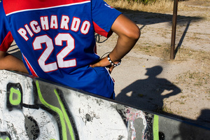 A player takes a break during weekly training. He wear the shirt of one of his favorite Dominican players.