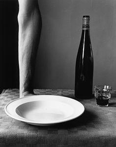 Arm and wine bottle