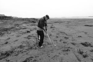 Massimo from the Argentario plays golf on the beach dunes.