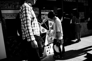 A girl play to a promotion game of electroonic shop in Shinjuku
