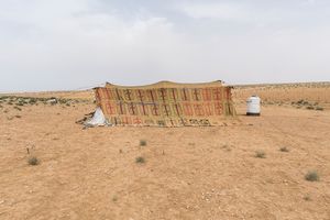 A tent in an impromptu camp at the outskirts of Azraq. Most families have pitched tents they took when they left Zaatari but some hadn’t been to the refugee camp and had to scrape whatever materials were available to build shelter. © David Brunetti