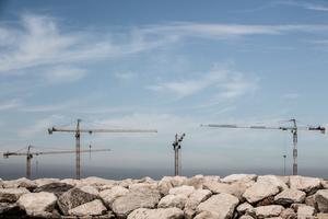 Construction cranes of the MOSE project are seen behind a wavebreak at Chioggia inlet on September 28, 2012. All inlets have been reinforced years ago.