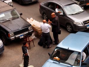 Negotiating about bread's price in the middle of a crossroad