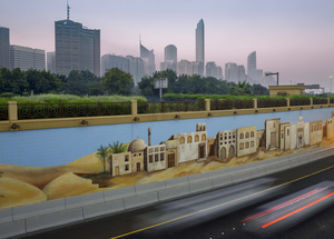 Abu Dhabi skyline with freeway underpass.