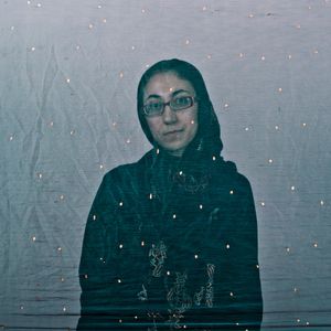 Fereshteh, an Iranian woman is photographed through the fabric of her hijab (the Islamic headscarf worn by women in the presence adult men who are not members of her immediate family). Since the Islamic revolution in 1979, Iranian women are not allowed to be seen in public without proper Islamic head dress in Iran. Not wearing a proper hijab is illegal and can result in arrest by a special police
