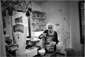 old woman in an old spanish kitchen