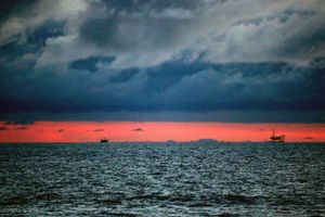 Pirate Ships Under Clouds