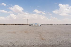 A newly pitched tent in Zaatari RC. Most new arrivals are initially housed in tents and have to wait until a prefab unit becomes available. The camp is set in inhospitable desert and the surroundings are bleak. With few barriers to protect against the relentless wind and dust, many are suffering from severe respiratory conditions, pneumonia and dehydration during the dry season. © David Brunetti