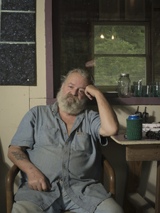 Ed Roberts is a part time country singer and sells his CDs at the Wagon Wheel Flea Market in Otto, North Carolina.