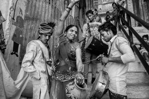 The mother of the bride with the groom and musicians.