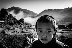 A boy against a background of the Himalayas in Baluwa, near the epicenter of the earthquake of 25 April 2015.