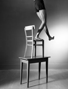 Man, chair and table