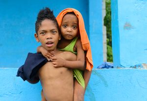 The Aeta brother takes care of his younger sister because she is sickly.
