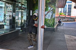 Man Circling Pole Outside Subway