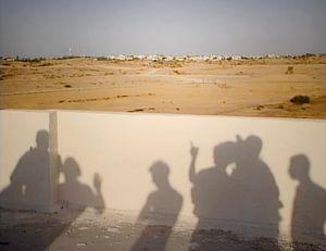 Gaza (2005). The shadows of Palestinian youths are projected on the wall of the house where they gathered to 'spy' on  the Israeli settlement of Eli Sinai, on the eve of its evacuation under the Disengagement Plan.