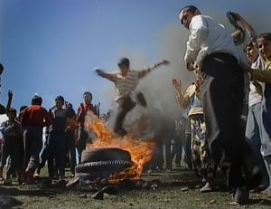 In the hills around Cizre, south-east Turkey. March 20, 2003. Newroz.  Kurdish boys jump over burning tyres. Fire means testing one's readiness to fight.